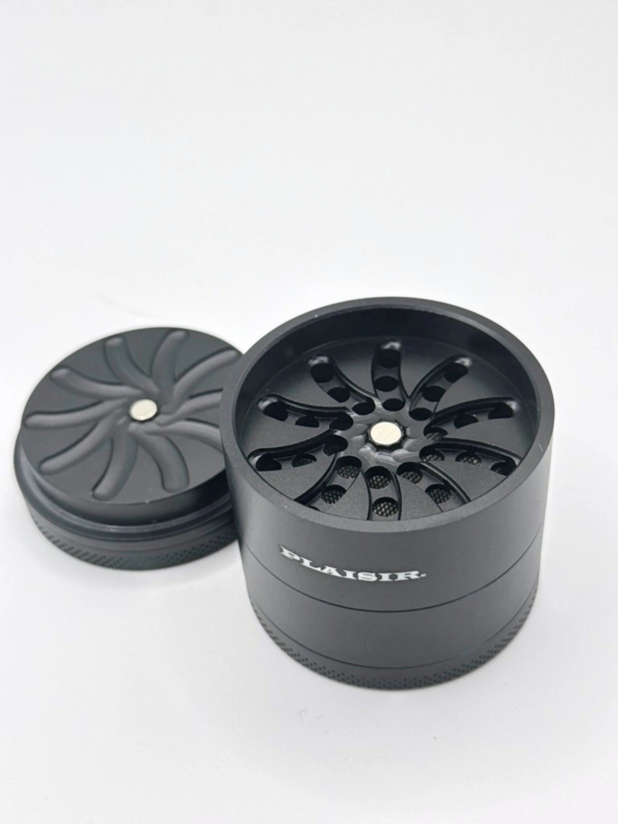 Minimalistischer Plaisir Aluminium Grinder ohne Zähne in modernem schwarzem Design